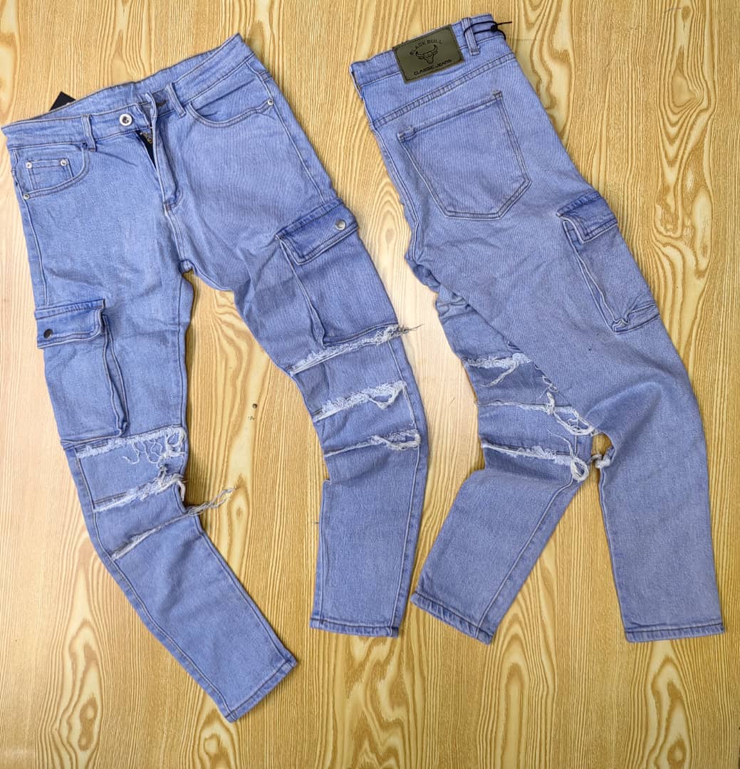 Light Blue distressed jeans with cargo pockets and knee-length rips