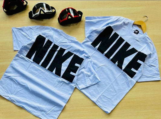 White Nike T-shirts with bold black "NIKE" lettering across the back